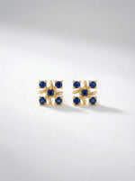`8k Gold plated earrings with blue gemstones on a light gray background