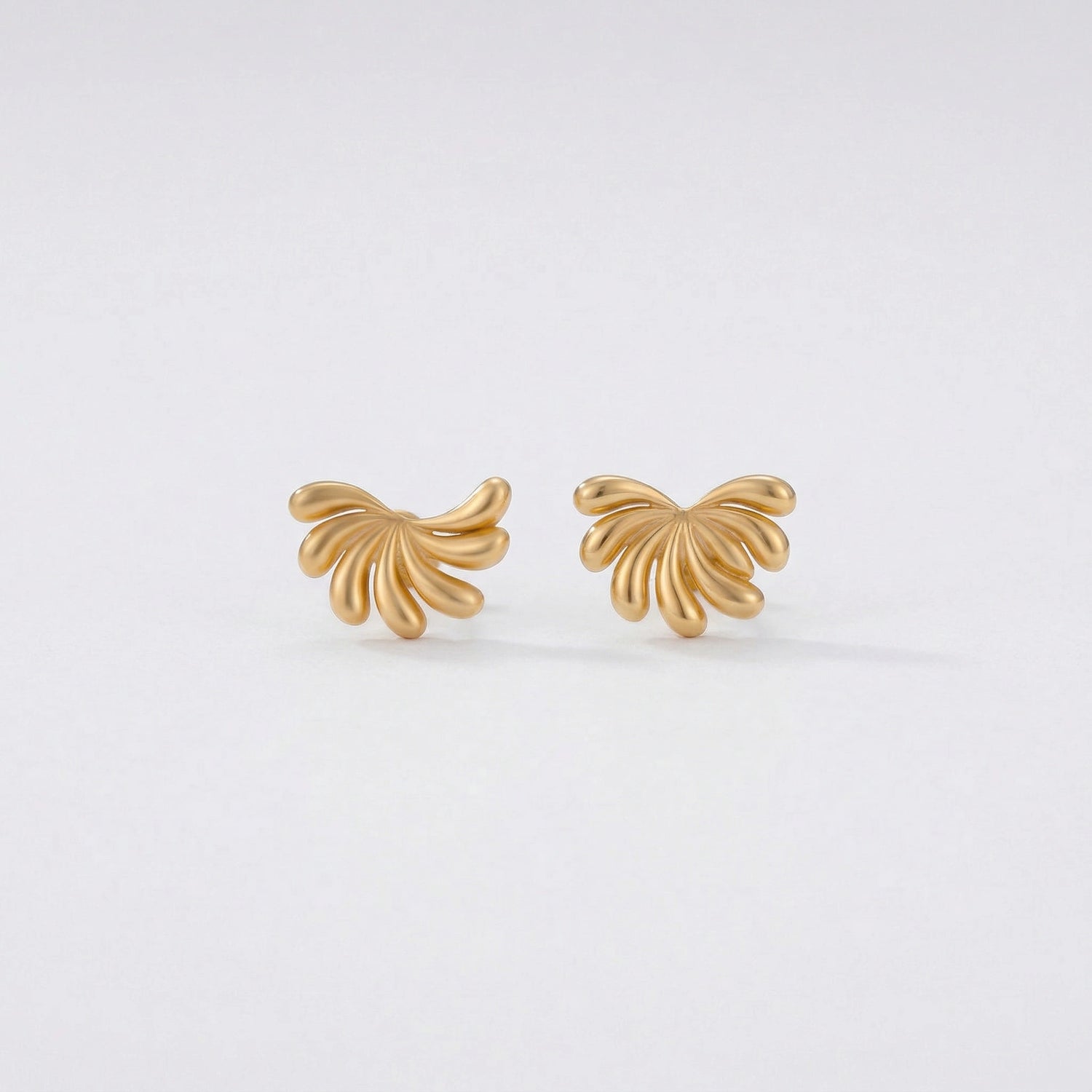 18k Gold plated butterfly-shaped earrings on a light gray background