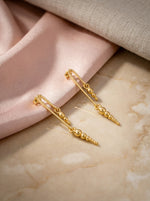 18k Gold plated chain earrings on a soft fabric background