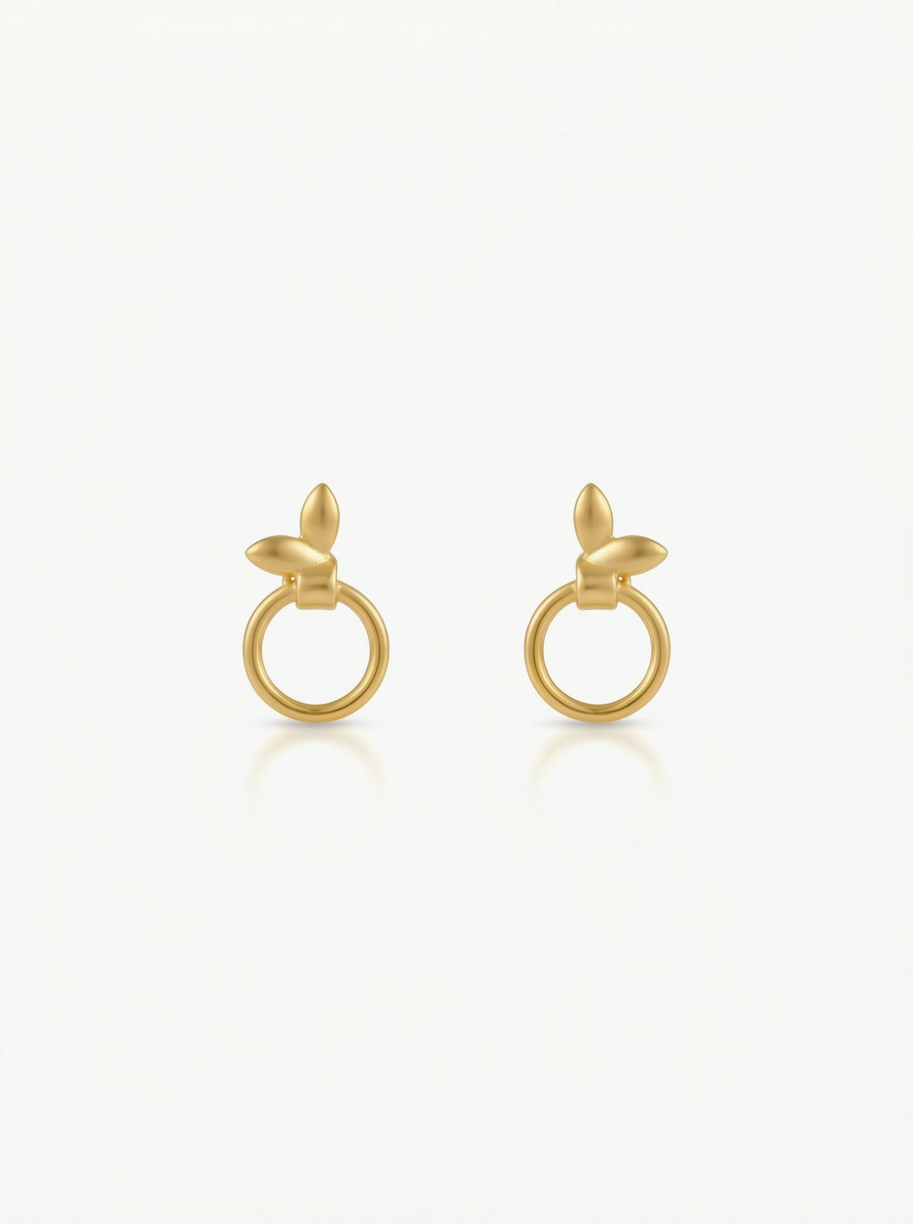 Pair of 18k gold plated earrings on a white background