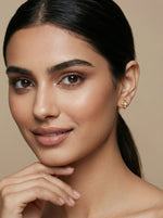 Close-up of a woman with a neutral background