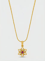 18k Gold plated necklace with a floral pendant on a light gray background