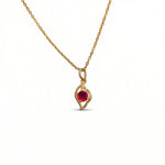 18k Gold plated  necklace with a red gemstone pendant on a white background