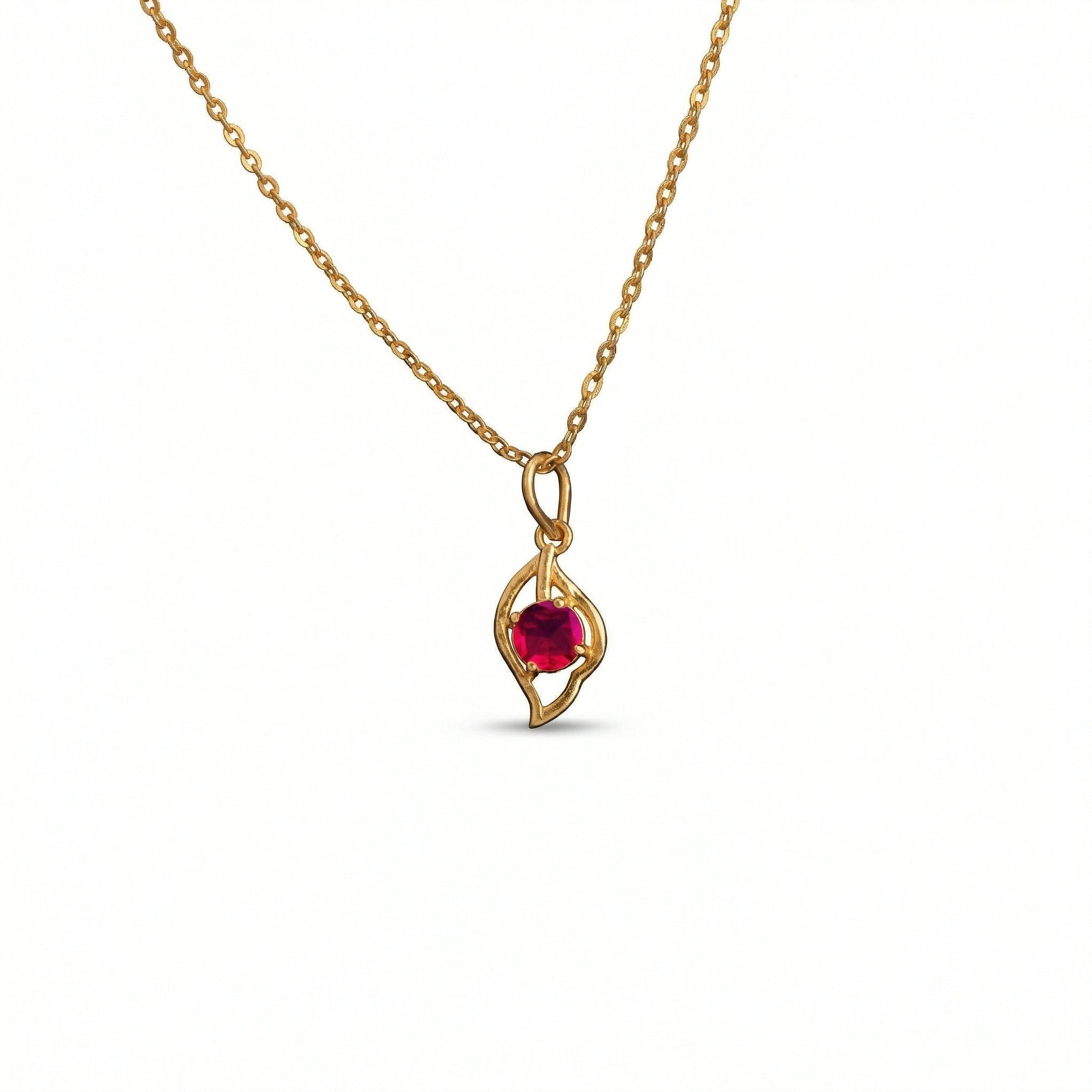 18k Gold plated  necklace with a red gemstone pendant on a white background