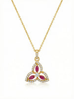 18k Gold plated necklace with a triangular pendant featuring red stones and diamonds on a white background