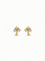 18k Gold plated cross-shaped earrings with diamond-like stones on a white background