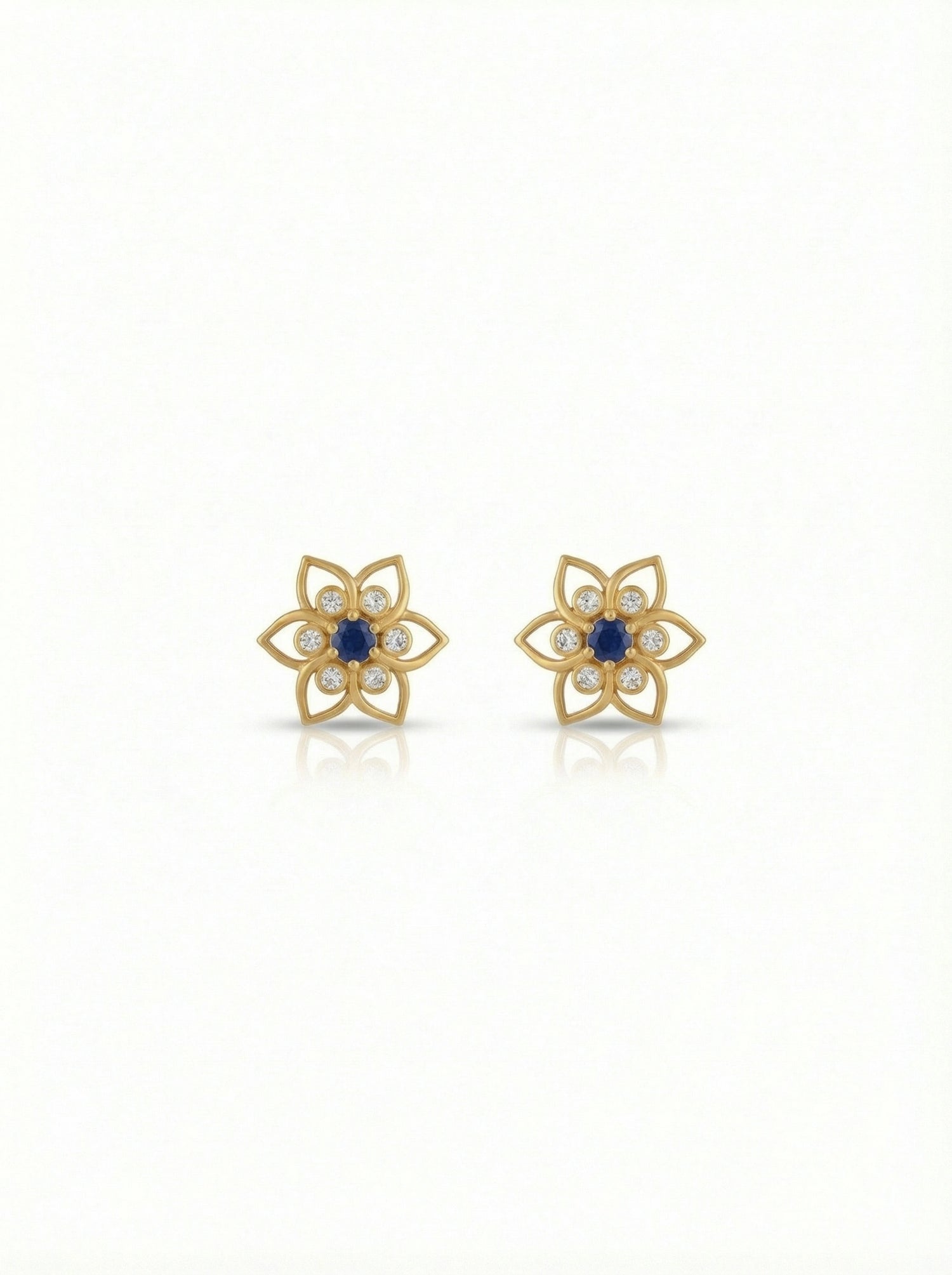 18k Gold plated  flower-shaped earrings with blue centers on a white background