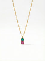 18K Gold PLATED necklace with a pendant featuring a green gemstone and pink stone on a white background