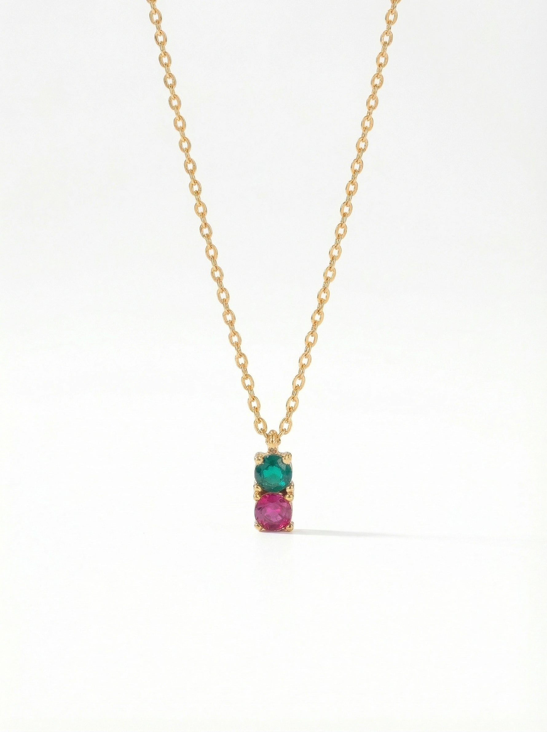 18K Gold PLATED necklace with a pendant featuring a green gemstone and pink stone on a white background