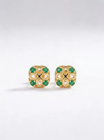 18k Gold plated earrings with green gemstones on a white background