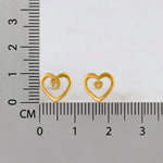 18k Gold plated heart-shaped earrings with embedded diamonds next to a ruler for scale on a white background