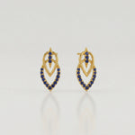 18k Gold plated  earrings with blue stones on a light gray background