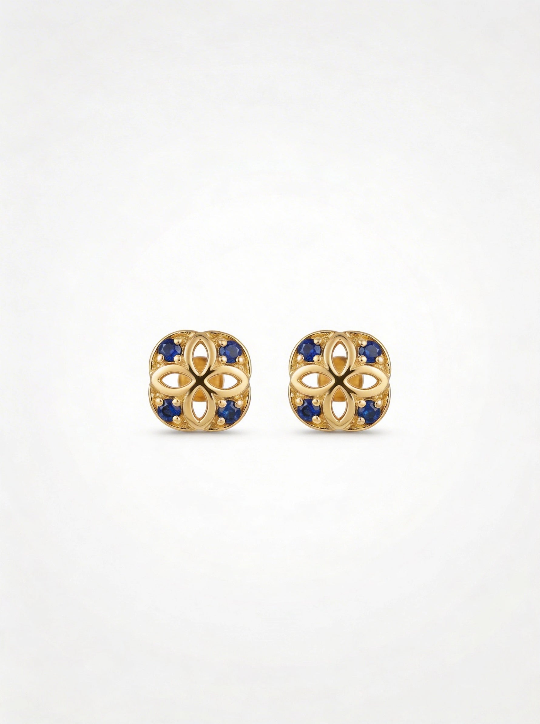 18k Gold plated earrings with blue stones on a white background