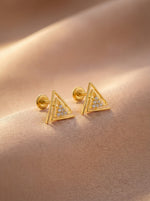 18k Gold plated  triangle-shaped earrings with embedded stones on a beige fabric background
