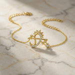 18k Gold plated bracelet with a sun and moon design on a marble surface