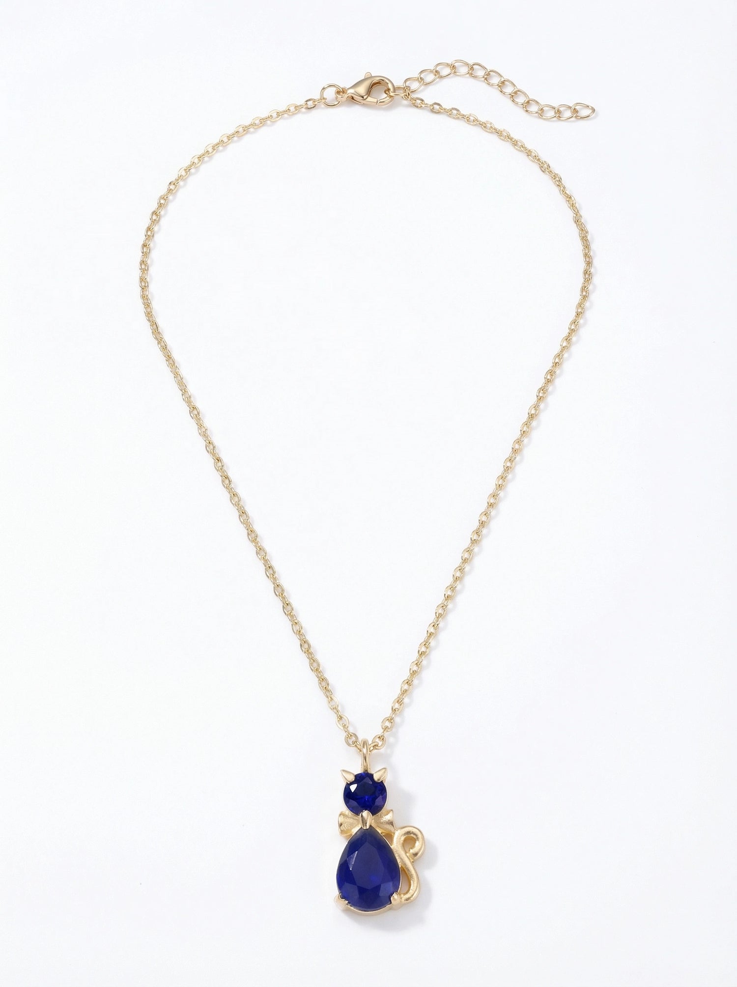 18k gold plated Gold necklace with a blue teardrop pendant on a white background