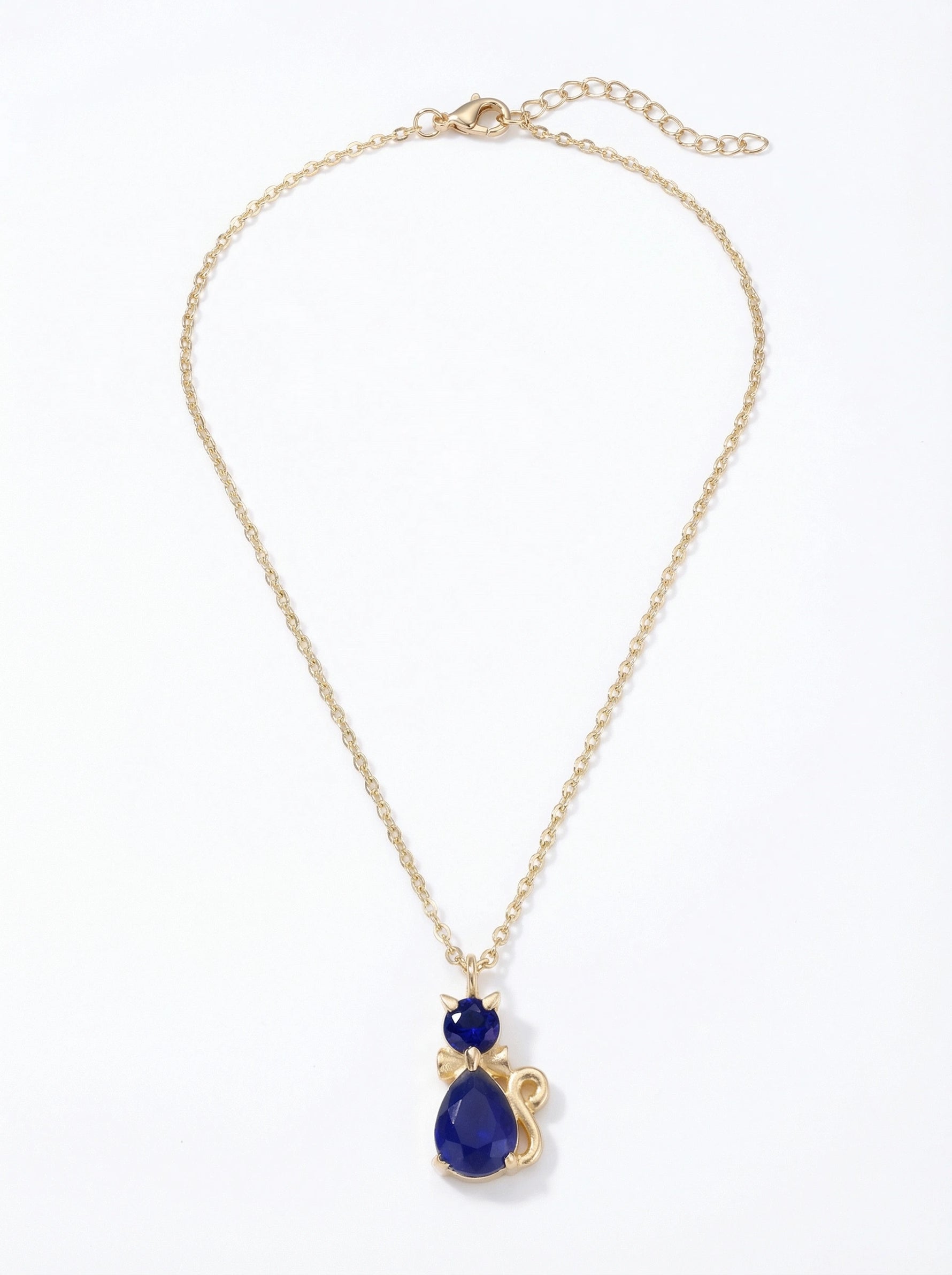 18k gold plated Gold necklace with a blue teardrop pendant on a white background
