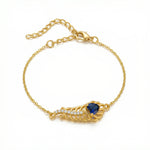 18k Gold plated bracelet with a blue gemstone on a white background