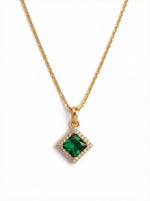 18k Gold plated necklace with a green gemstone pendant on a white background