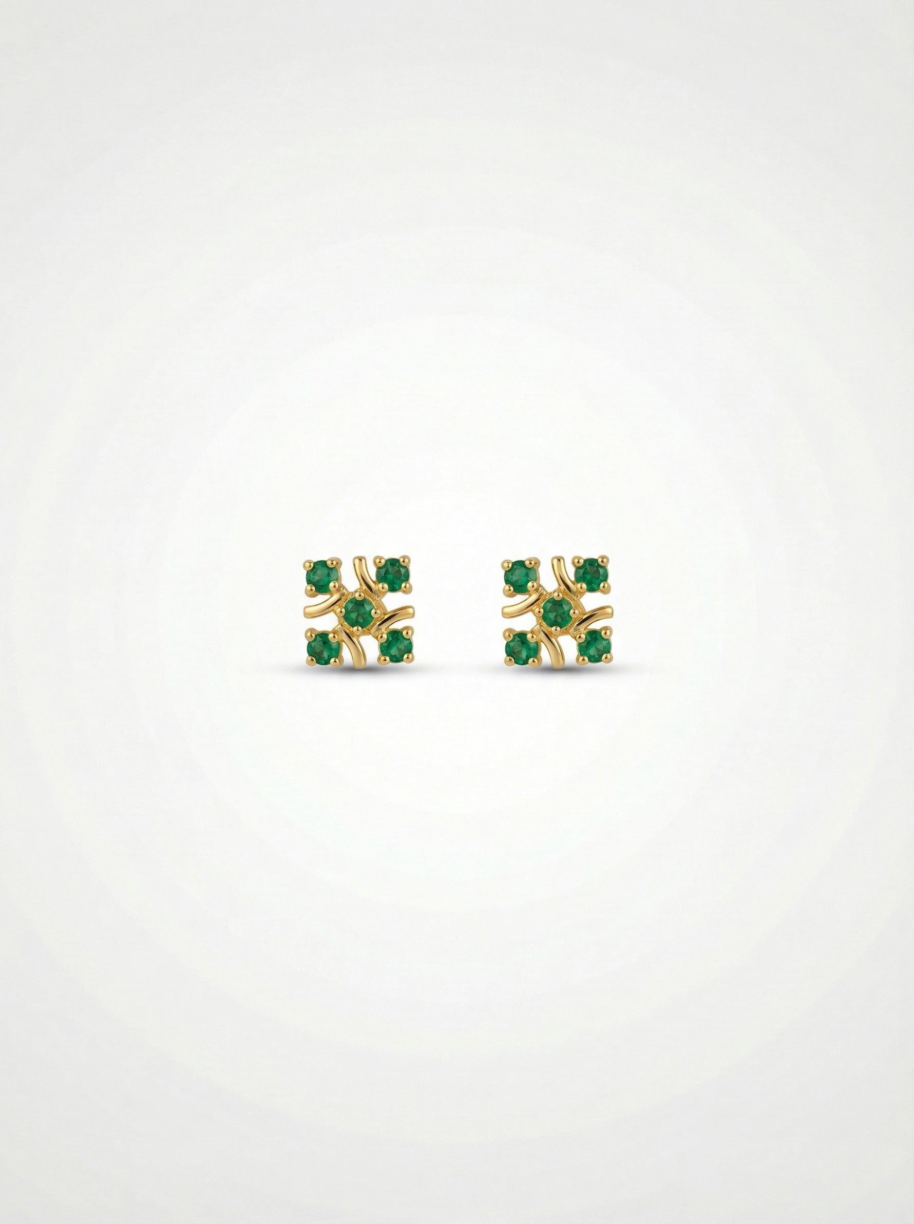 18k gold plated earrings with green gemstones on a white background