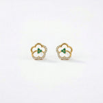 18k Gold plated earrings with green gemstones on a white background