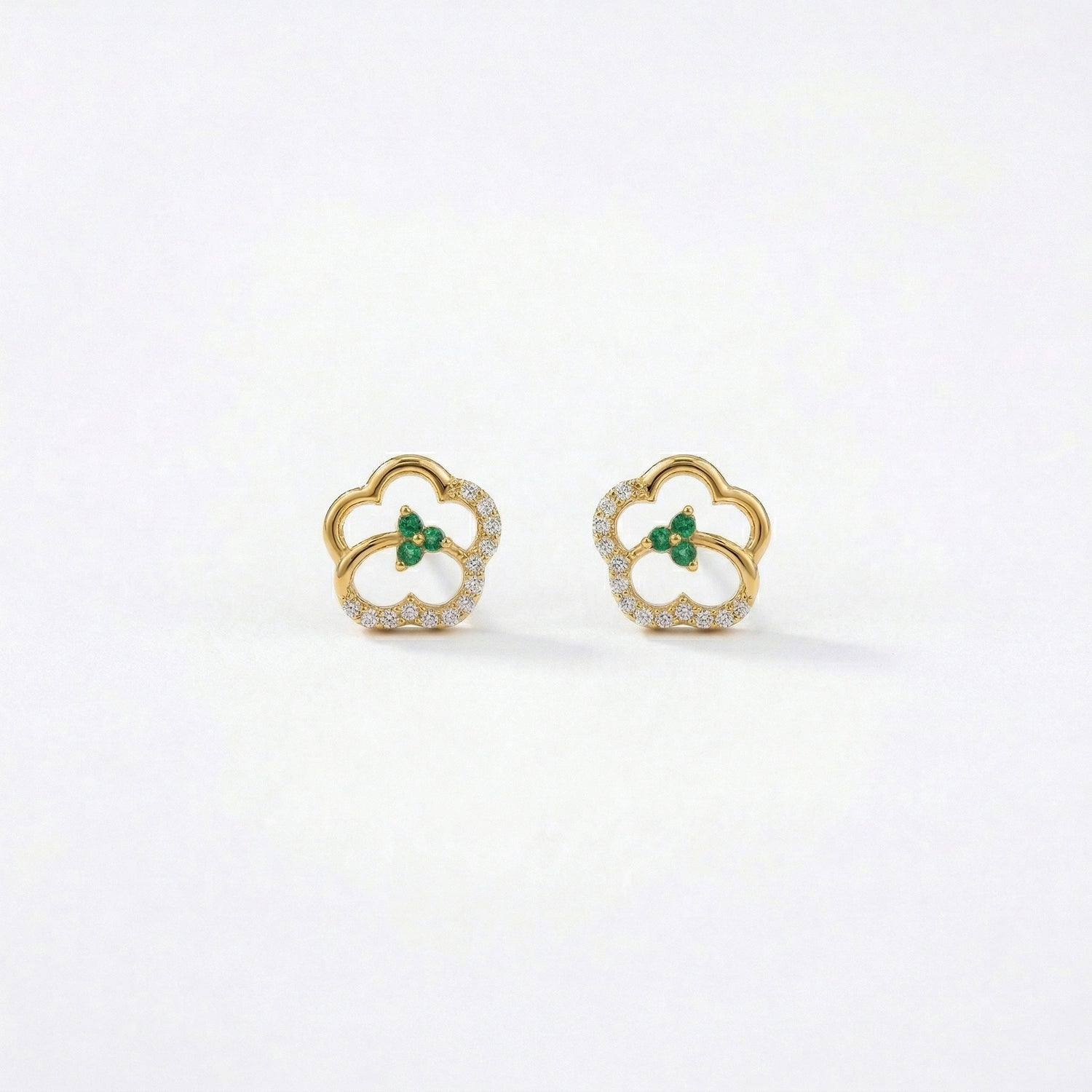 18k Gold plated earrings with green gemstones on a white background