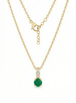 18k Gold plated  necklace with a green gemstone pendant on a white background
