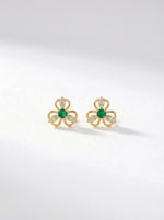 18k Gold plated earrings with green gemstones on a white background