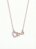  18k rose gold plated necklace with heart and infinity symbol pendant on a white background