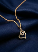 18k Gold plated necklace with a heart-shaped pendant on a dark blue fabric background