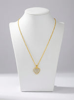 18k Gold plated necklace with a heart-shaped pendant on a white mannequin bust against a gray background
