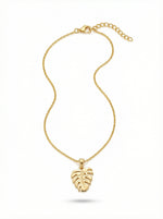 18k Gold plated necklace with a leaf pendant on a white background