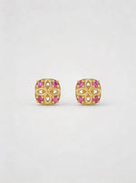 18k Gold plated earrings with pink gemstones on a white background