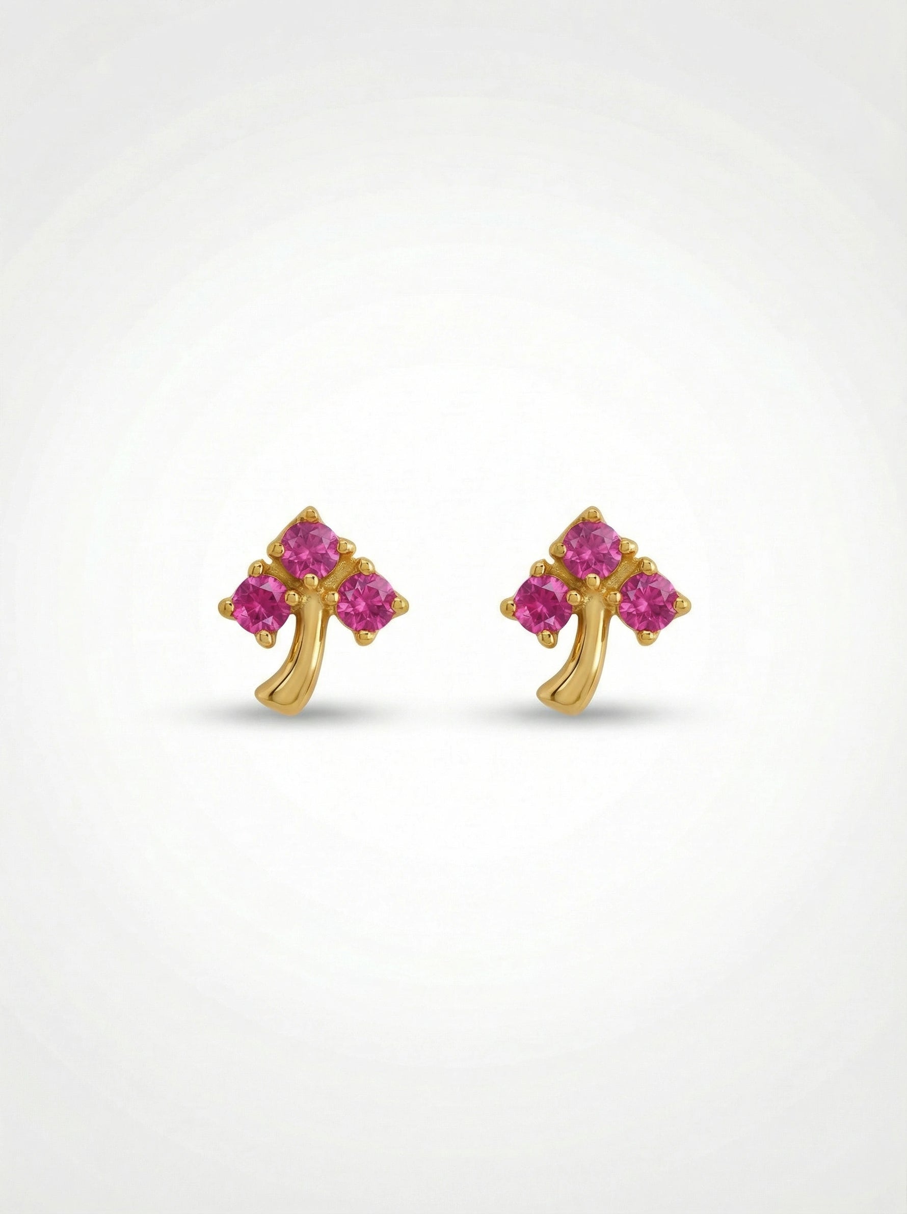 18k Gold plated  earrings with pink gemstones on a white background