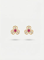 18k Gold plated bow-shaped earrings with red gemstones on a white background