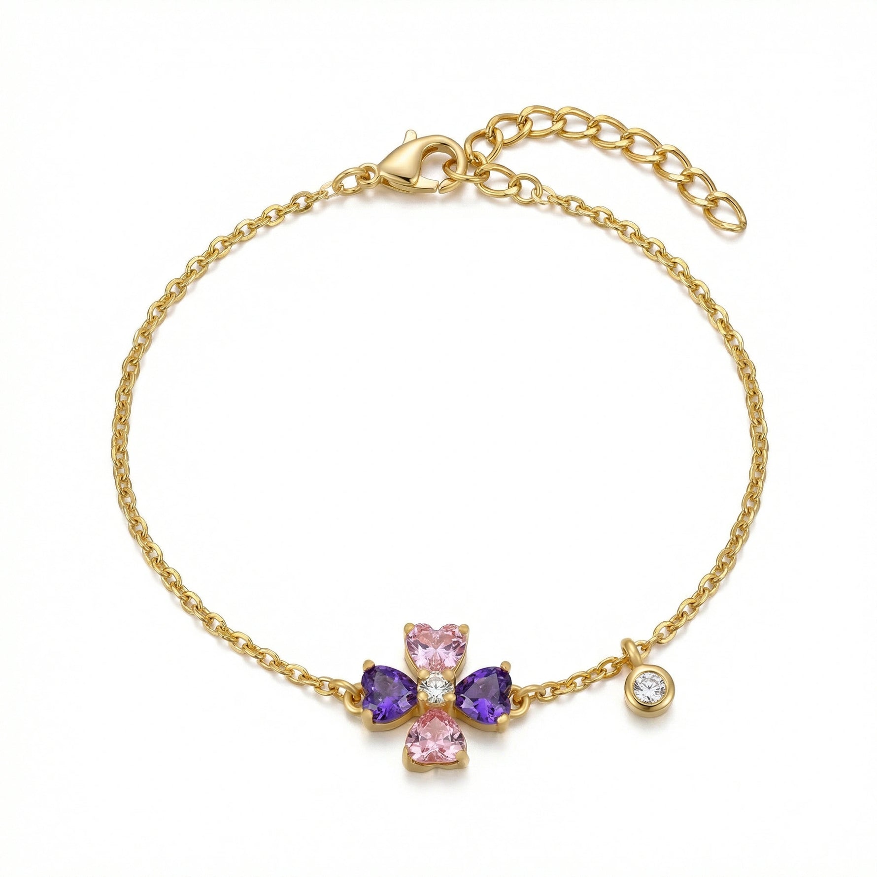 18k Gold plated bracelet with a cross charm featuring pink and purple stones on a white background