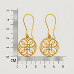 18k Gold plated earrings with intricate designs on a white background with a ruler for scale.