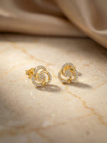 18k Gold plated earrings with diamond accents on a marble surface