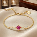 18kGold plated  bracelet with a pink gemstone on a beige surface