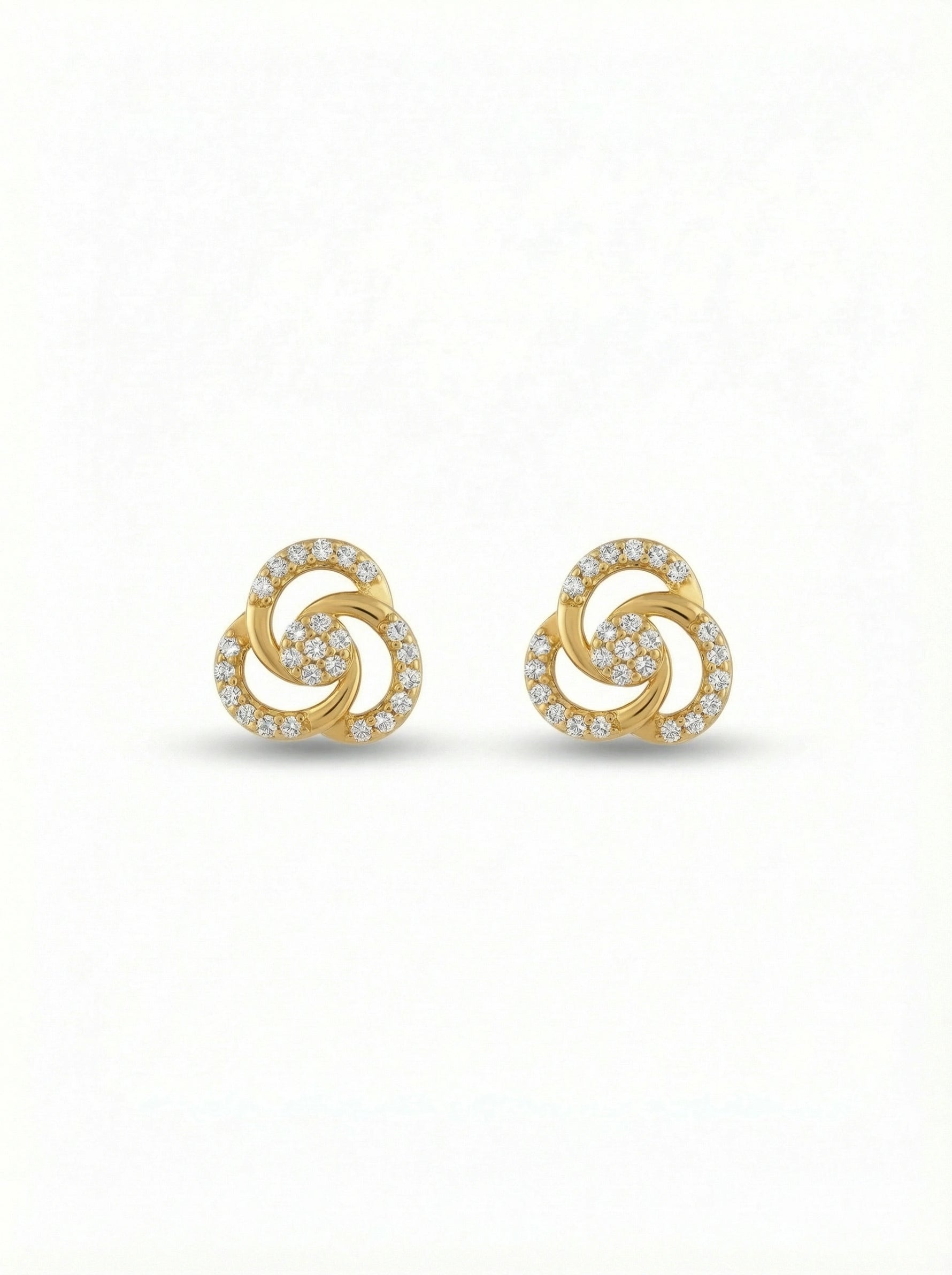 Pair of 18k gold plated earrings with a spiral design on a white background
