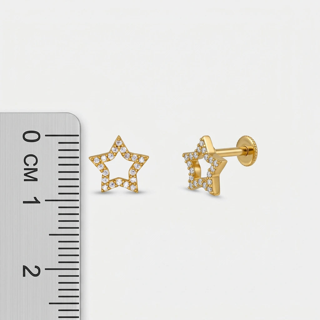 18k Gold plated star-shaped earrings with clear stones next to a ruler on a white background
