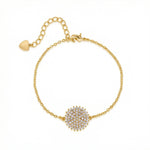18k Gold plated bracelet with a heart charm and diamond-studded flower clasp on a white background