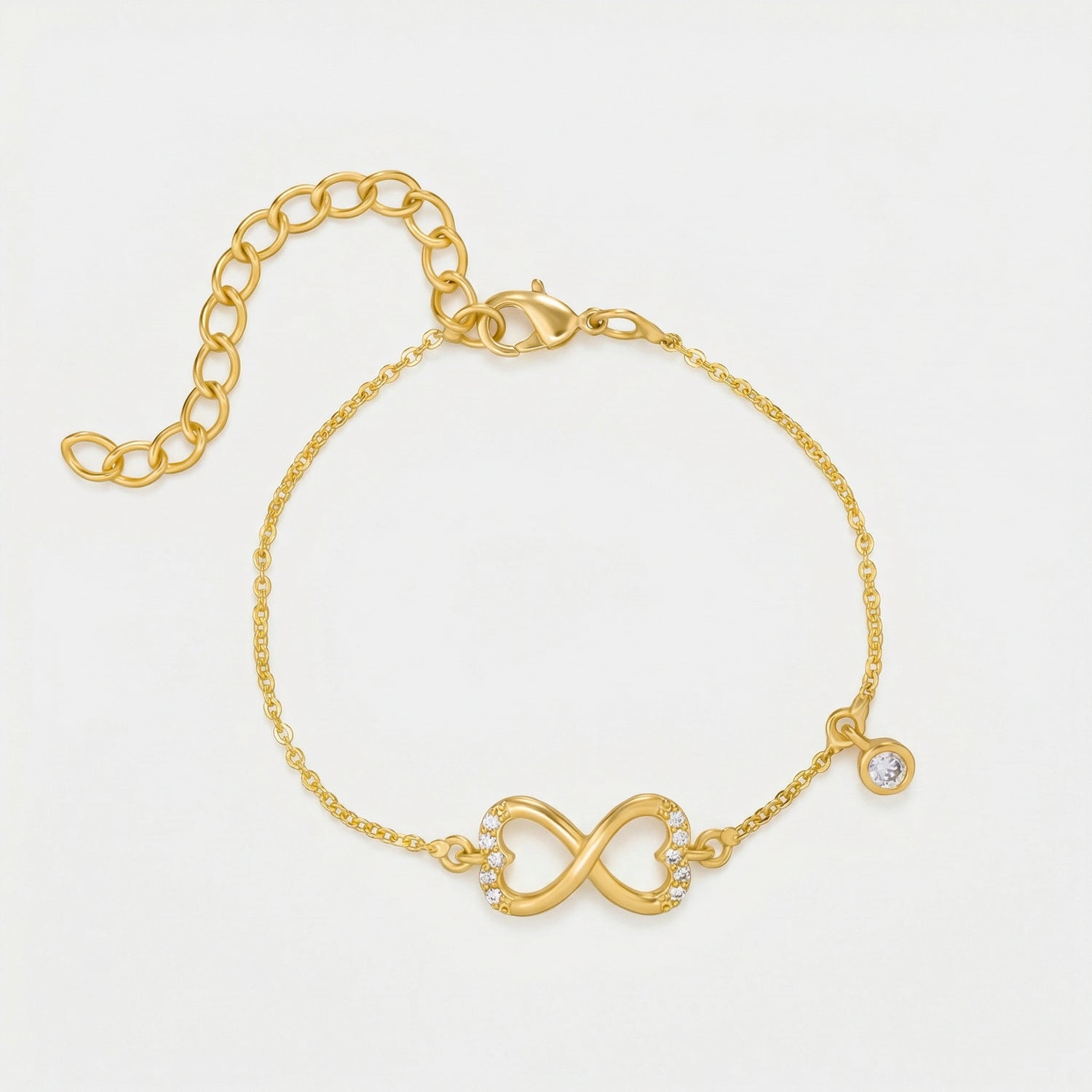 18k Gold  plated bracelet with an infinity symbol on a light gray background