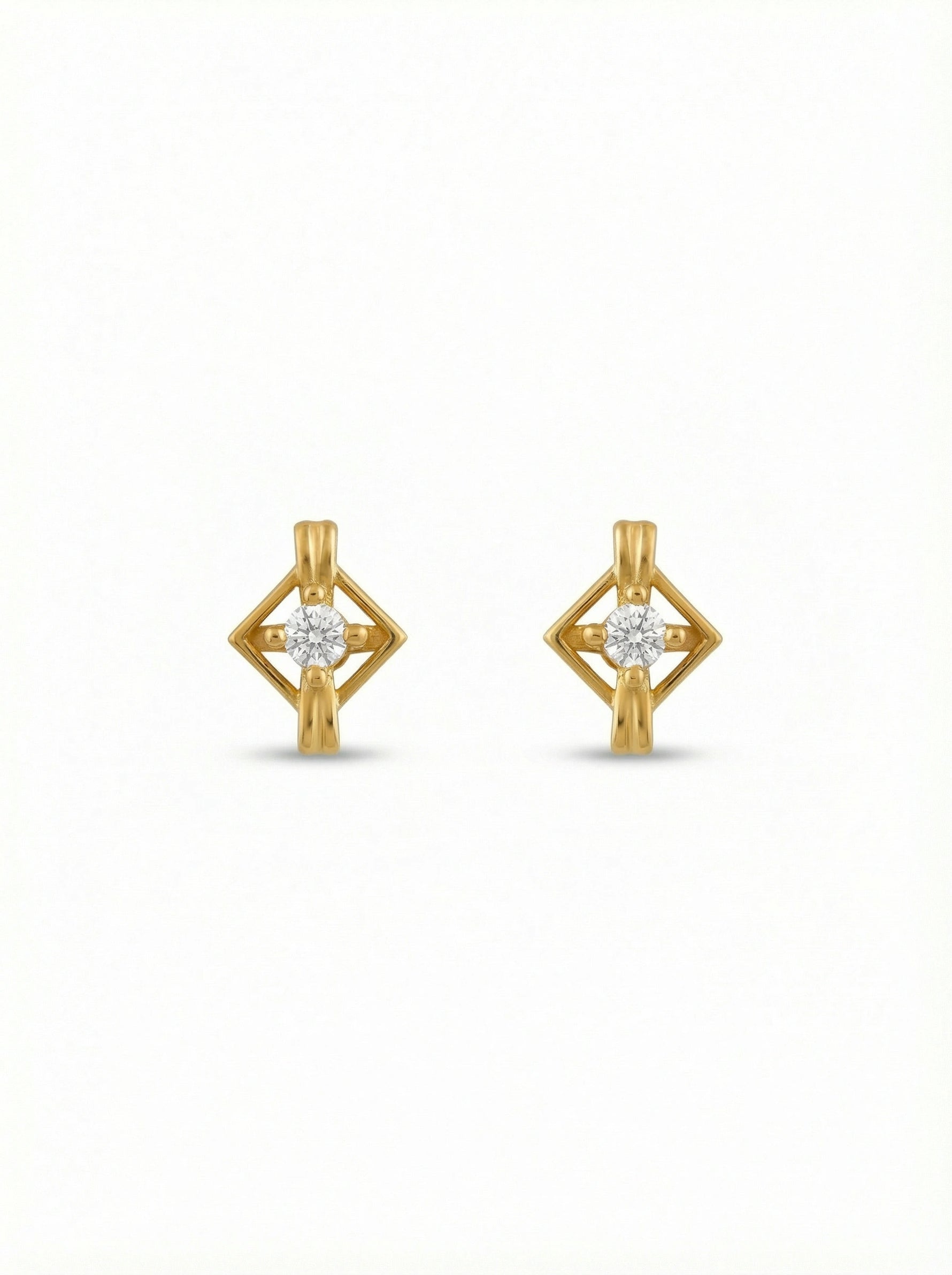 18k Gold plated earrings with diamond-like stones on a white background